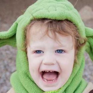 Child wearing a yoda halloween costume